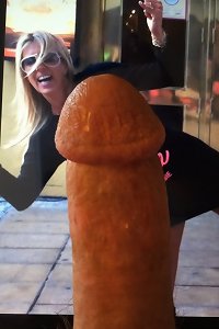 this female is on her bed pulverizing a guy that has huge furry labia